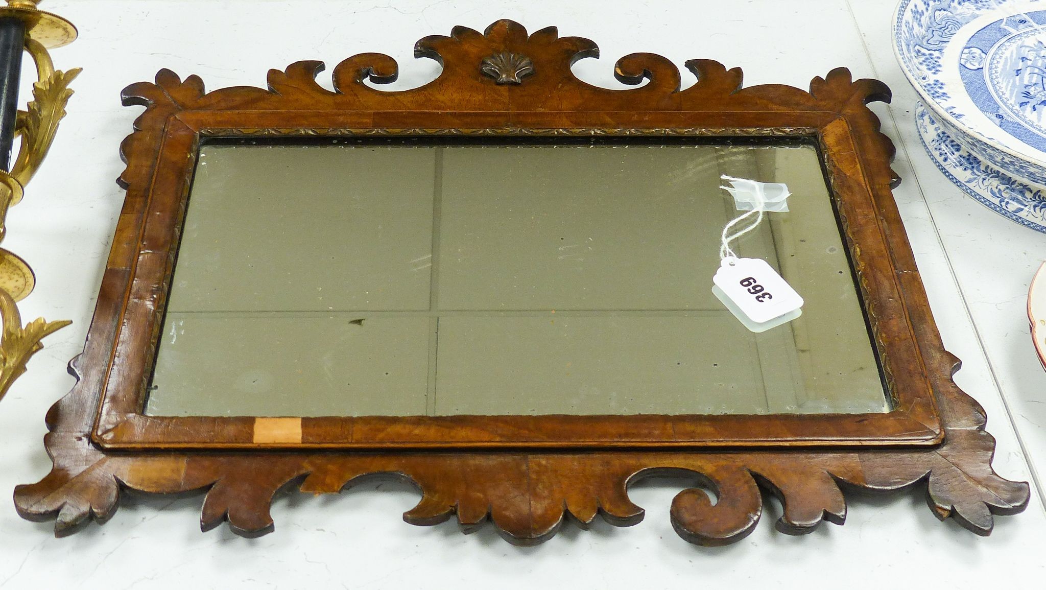 A walnut fret cut wall mirror 48x52cm